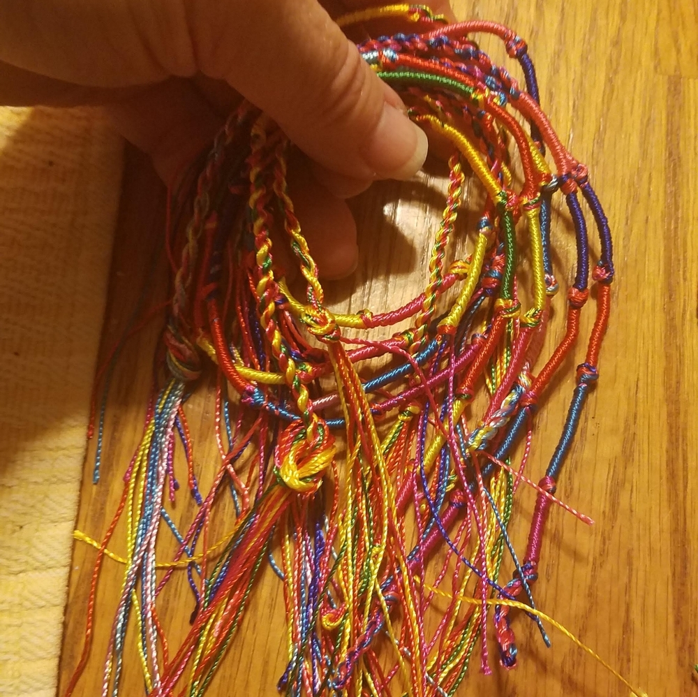 Assorted colors of handmade friendship bracelets 10 bracelets for $40